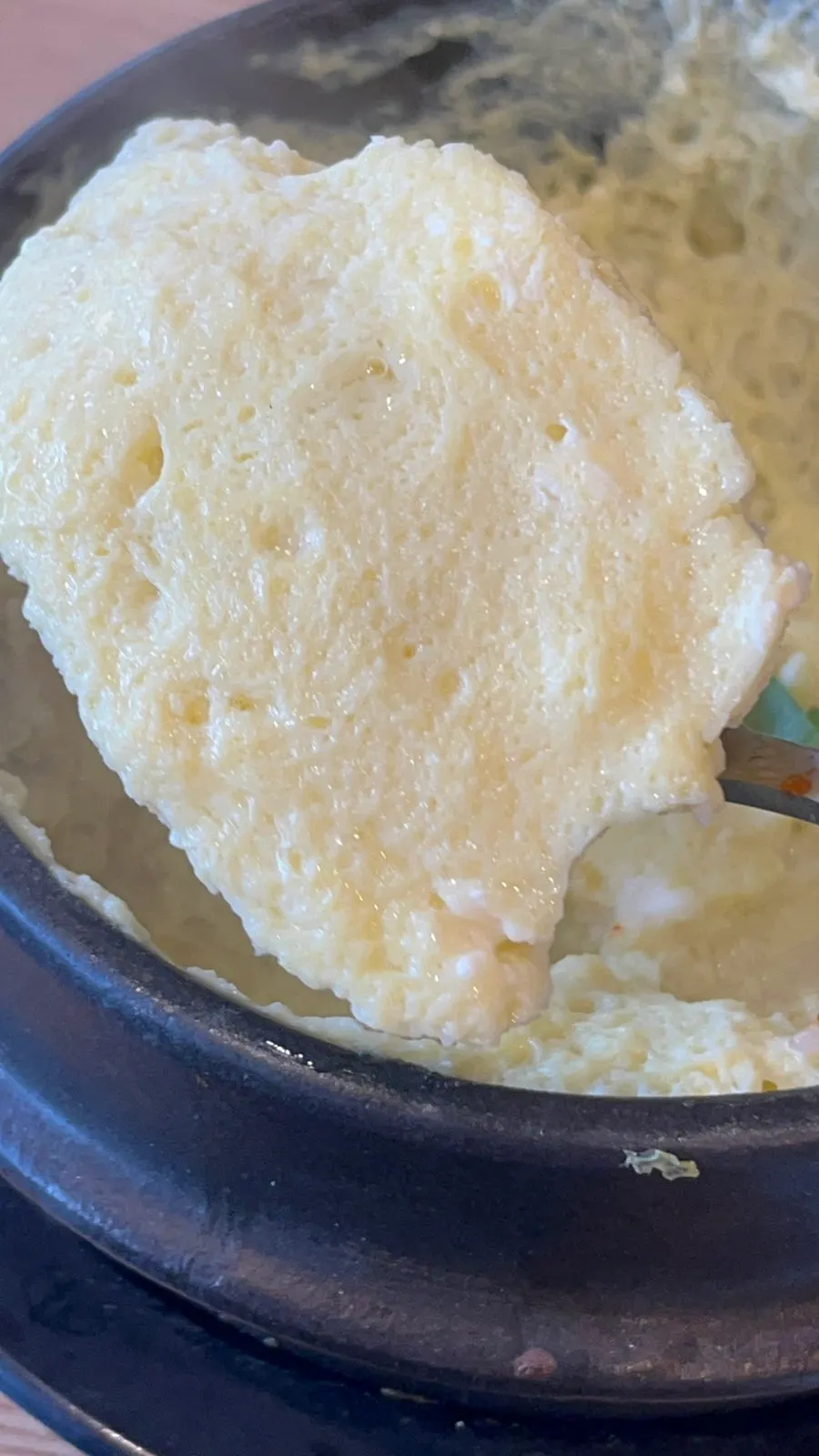 A spoonful of fluffy steamed egg