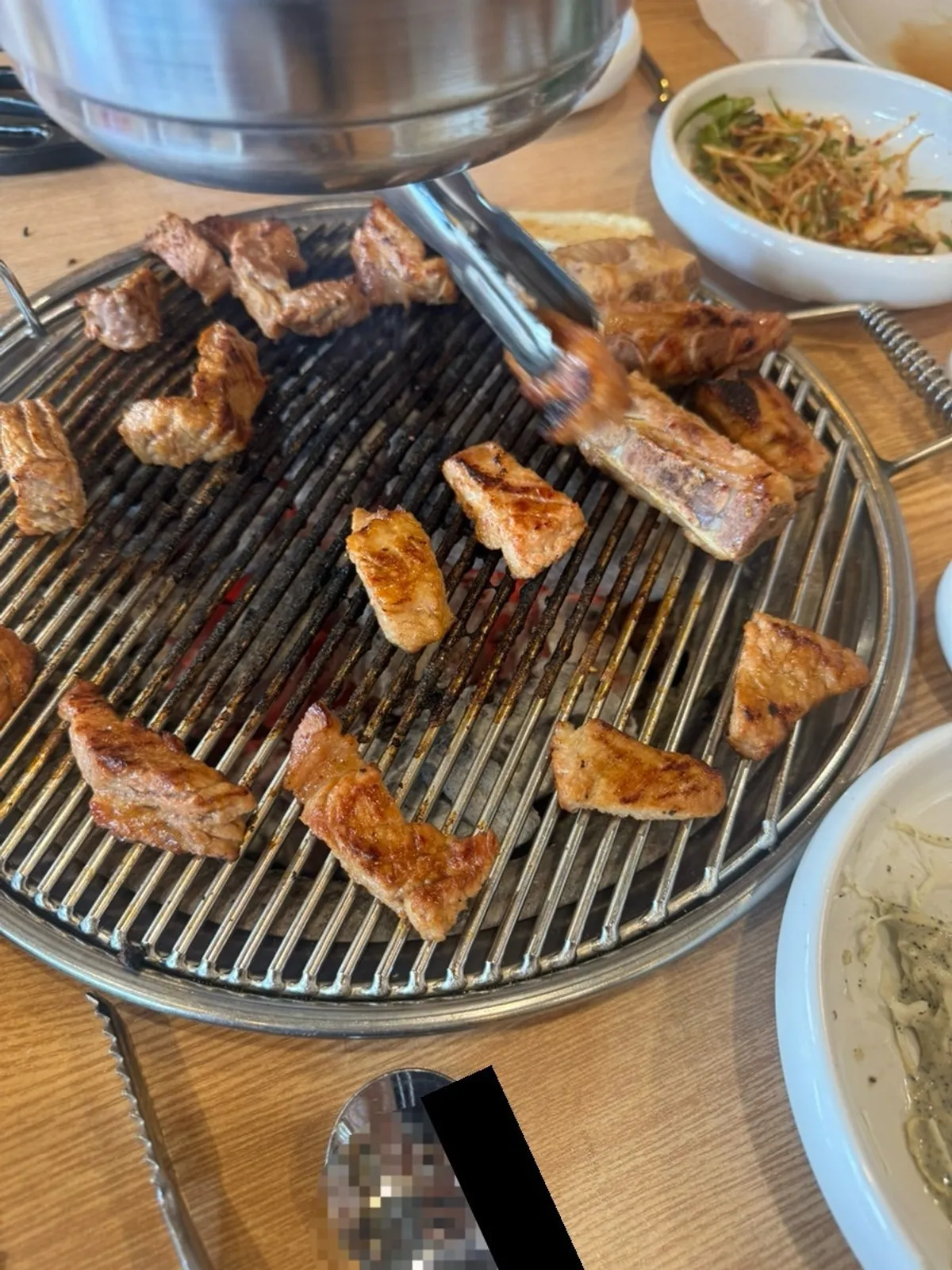 Pork galbi grilled moist and juicy after several flips