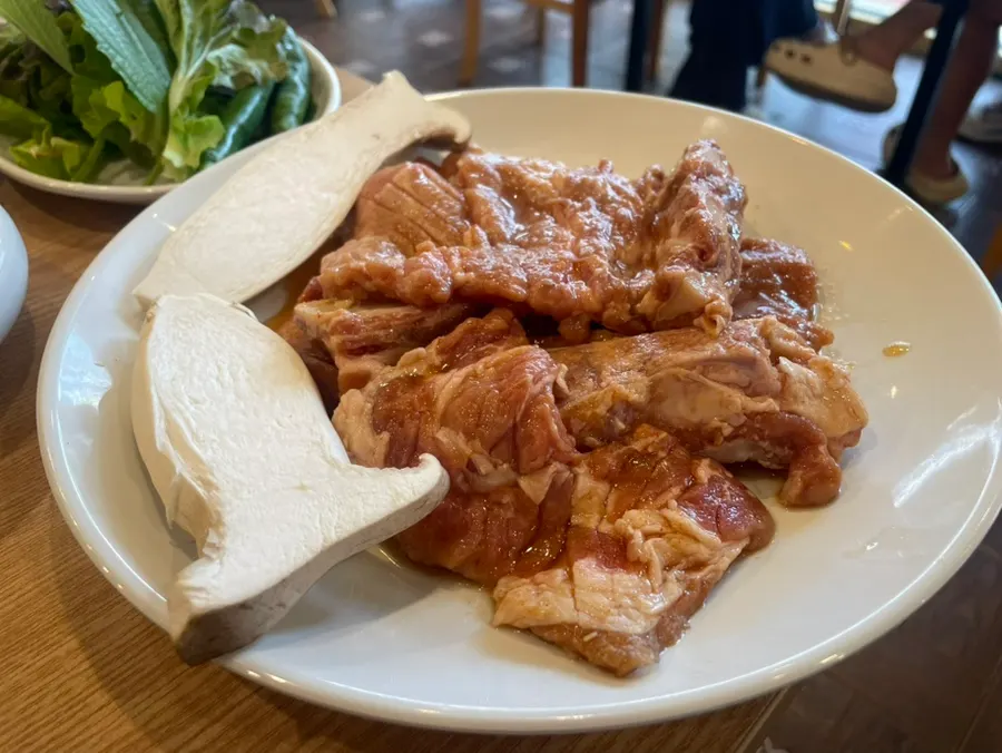 Korean pork marinated galbi placed on the charcoal grill