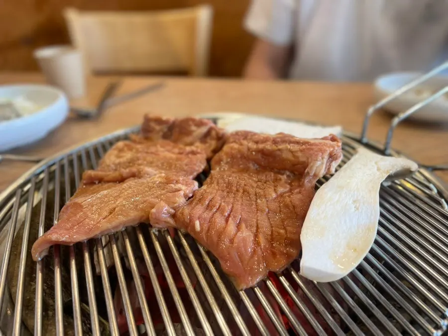 Marinated galbi cooking on the grill