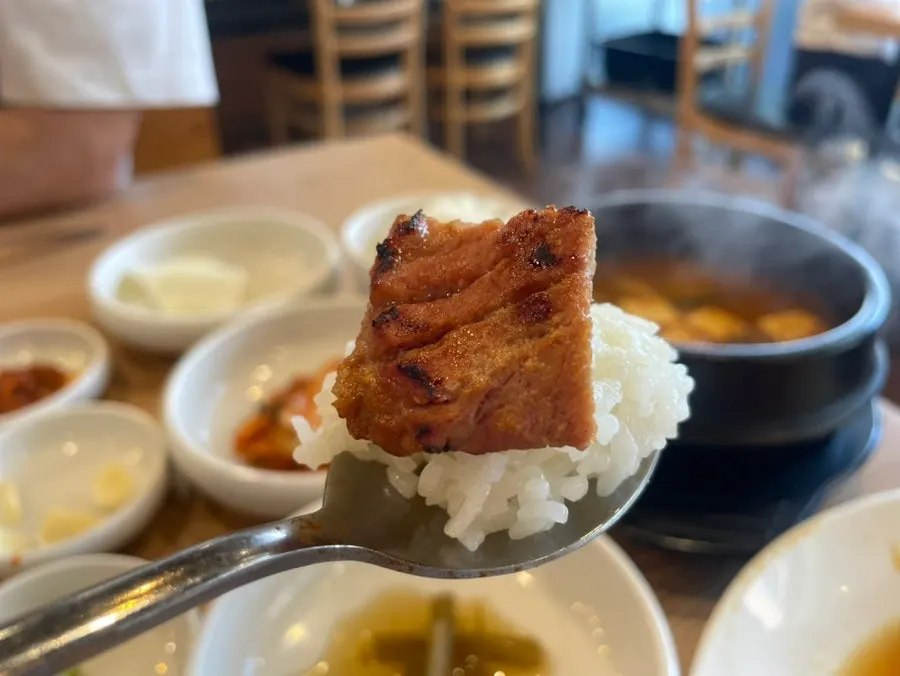 A piece of pork galbi paired with garlic
