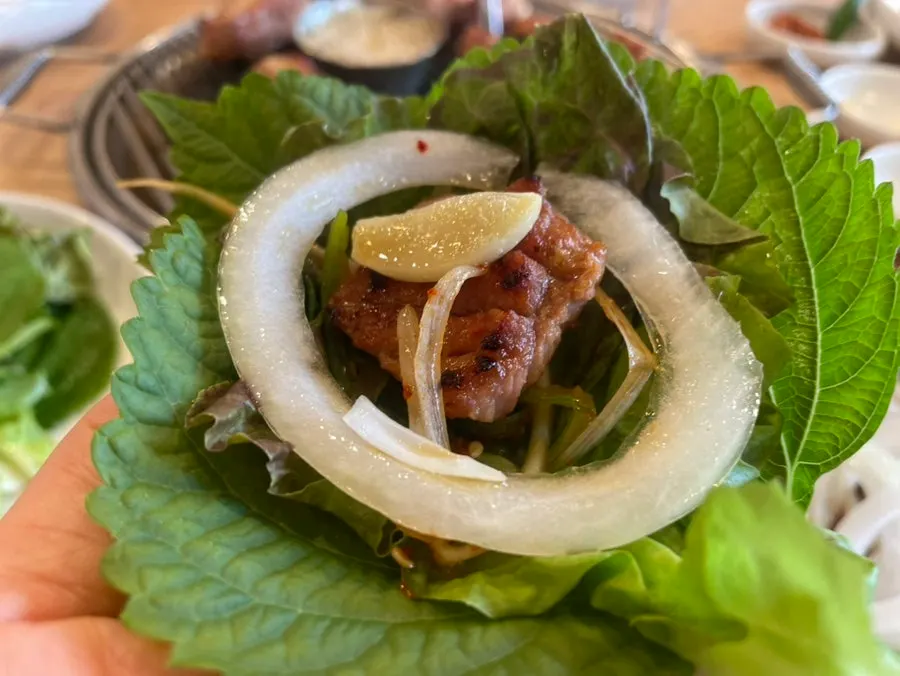 Pork galbi topped with scallion salad