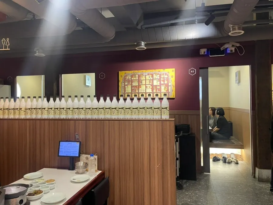 Hall seating inside Sanseong Meat Shop with steel interior
