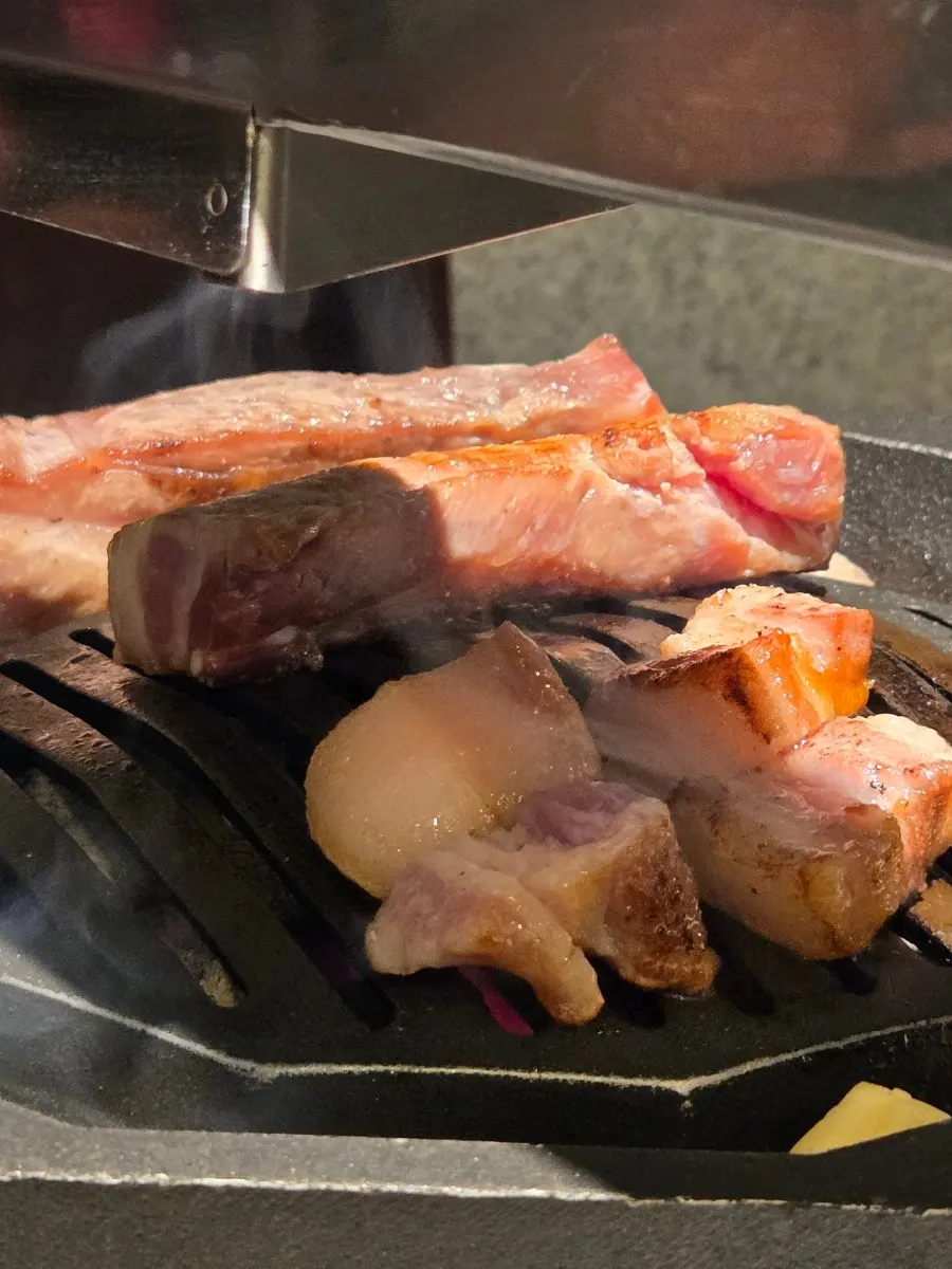 A piece of meat topped with pickled chili paste