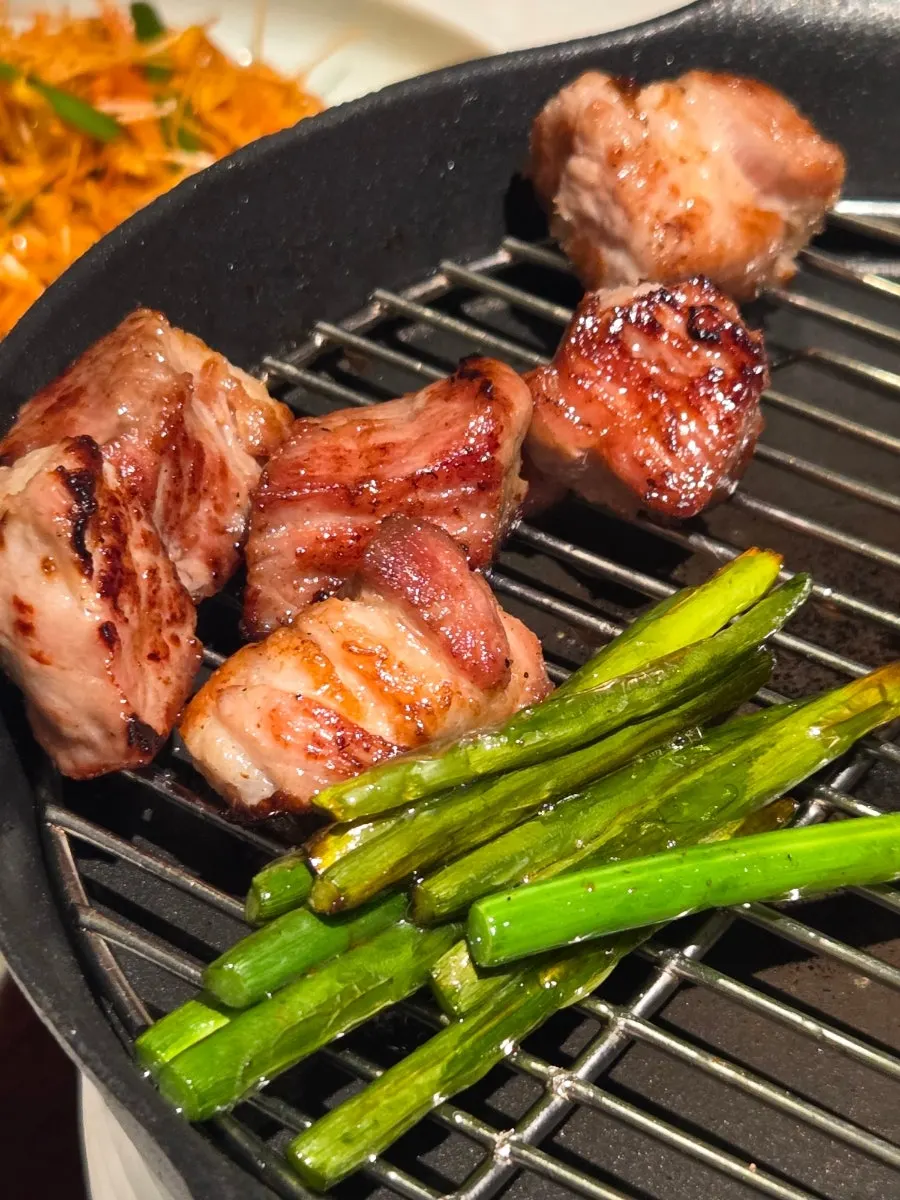 Nuruk pork neck cooking on the grill