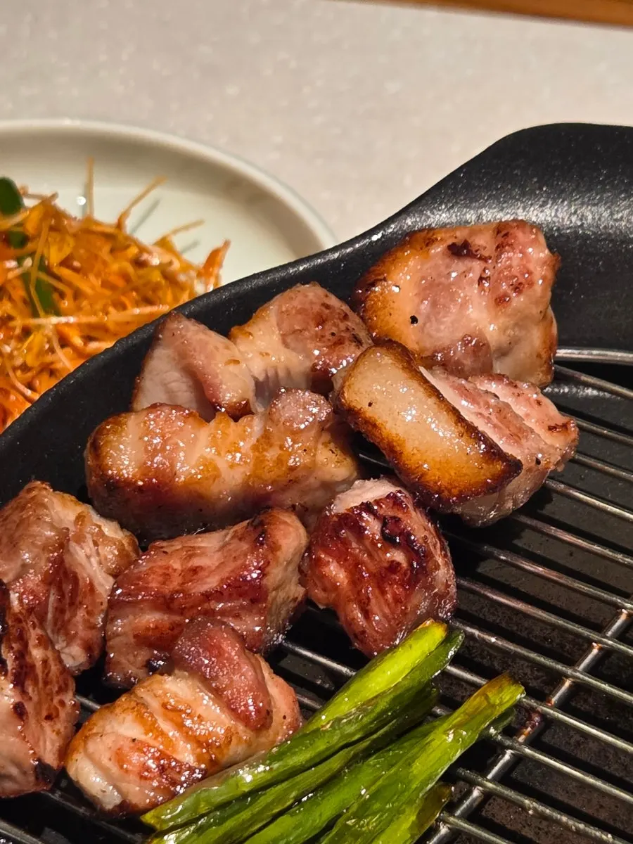 Pork neck and pork belly on the charcoal grill