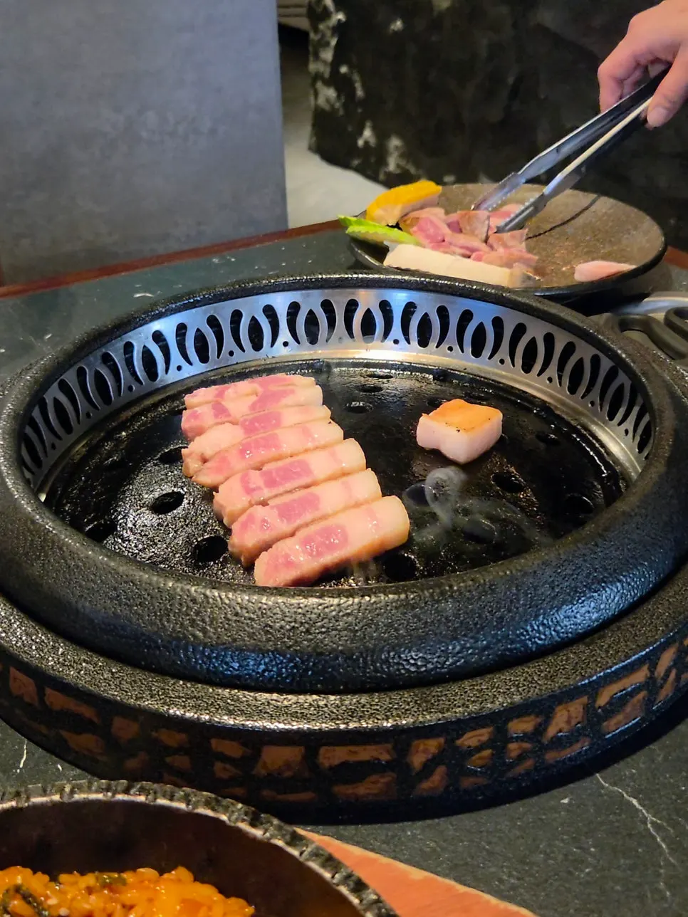 Aged pork belly and pork collar on the grill