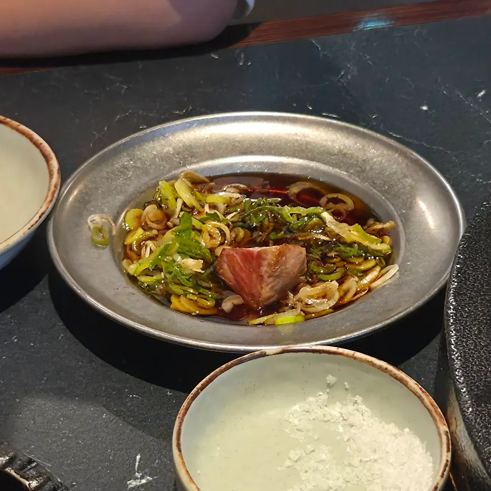 A piece of pork on a lettuce wrap