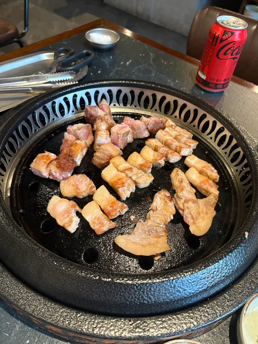 Aged meat and vegetables grilling on the pan
