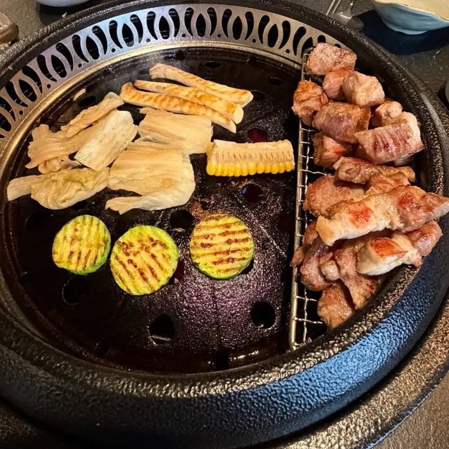 Grilled aged meat placed on the grill rack