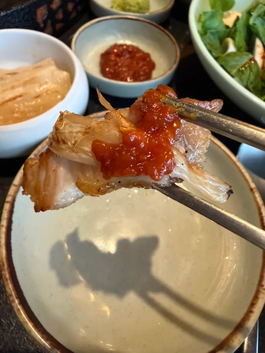 Meat topped with aged kimchi and ssamjang