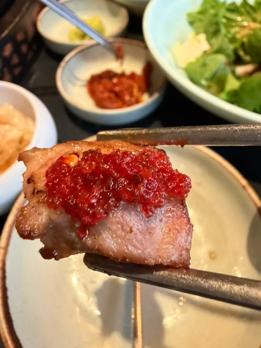 Meat topped with salted seafood