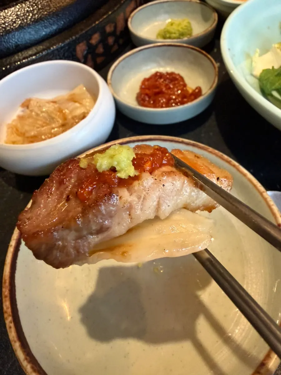 Meat topped with both wasabi and aged kimchi
