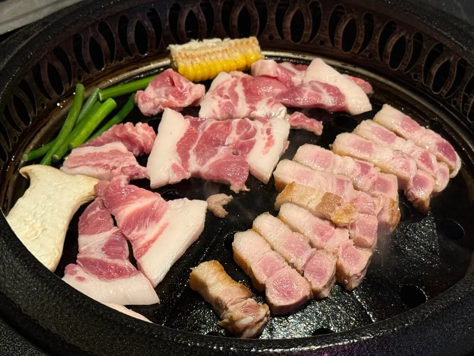Staff grilling meat on the grill