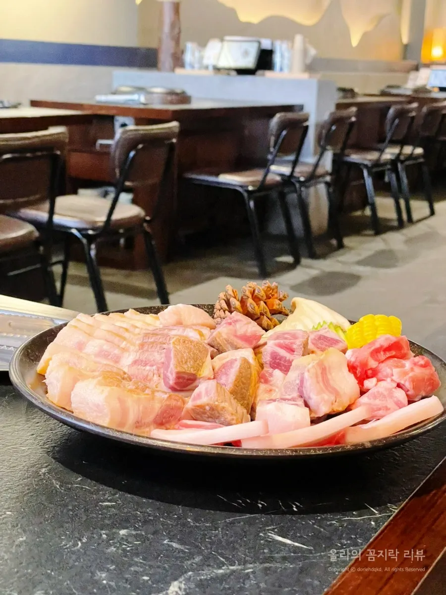 Grilled meat and side dishes at the edge of the grill