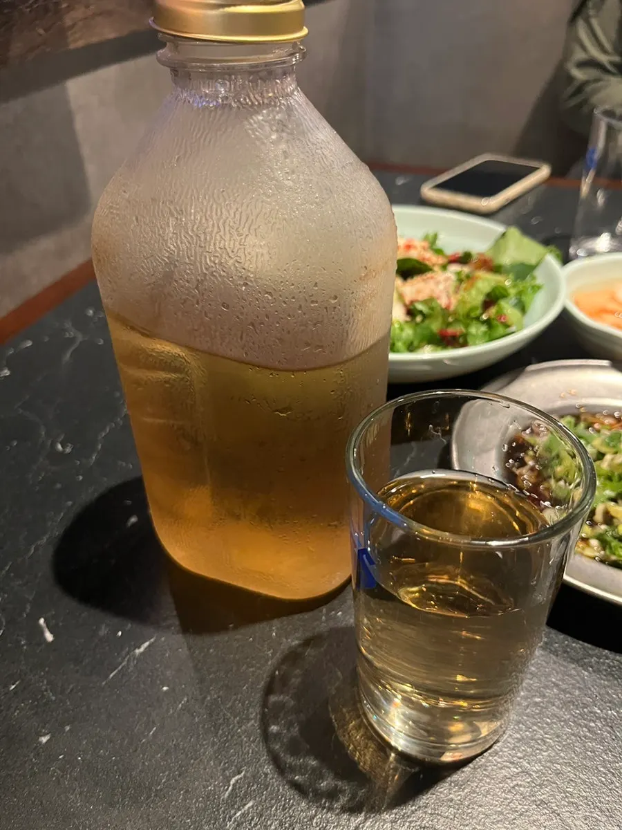 Barley tea served in a Del Monte glass bottle