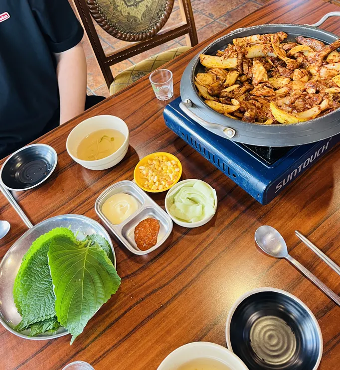 Pork kimchi grill with a glass of soju
