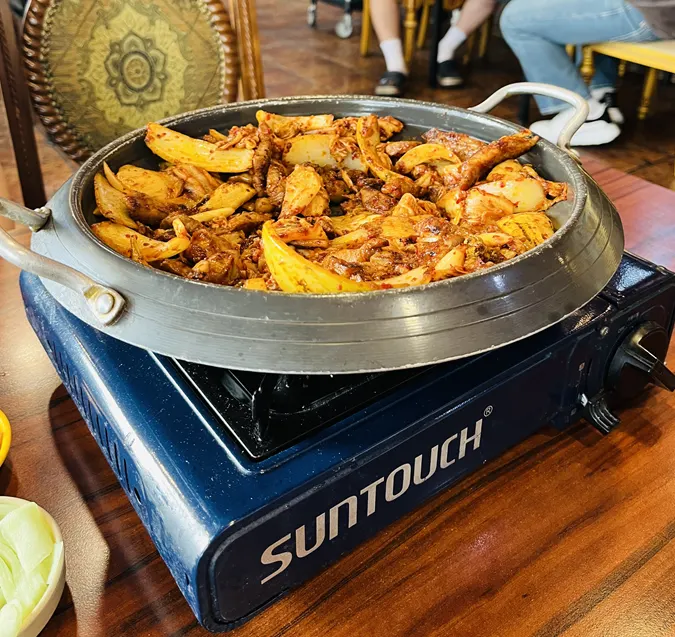 Pork kimchi grill placed on a perilla leaf