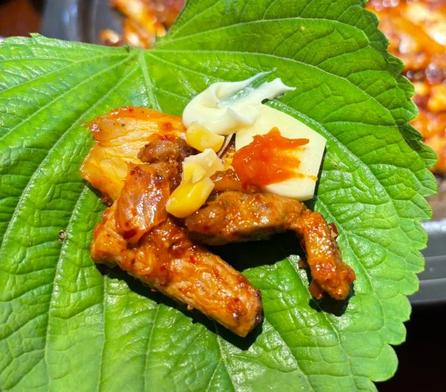 A bite-sized wrap loaded with side dishes
