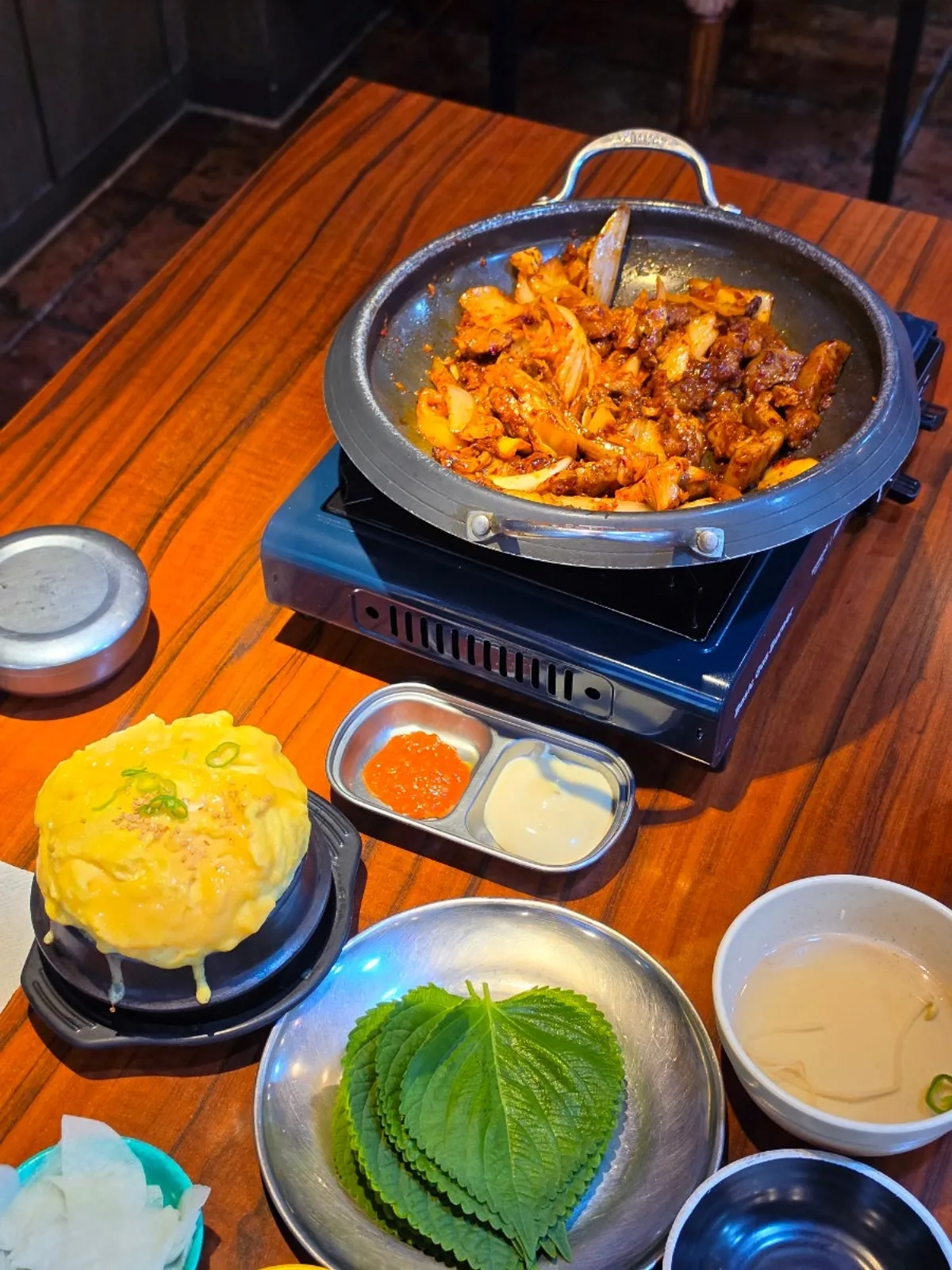 Perilla leaf wrap topped with pork kimchi grill and mayonnaise