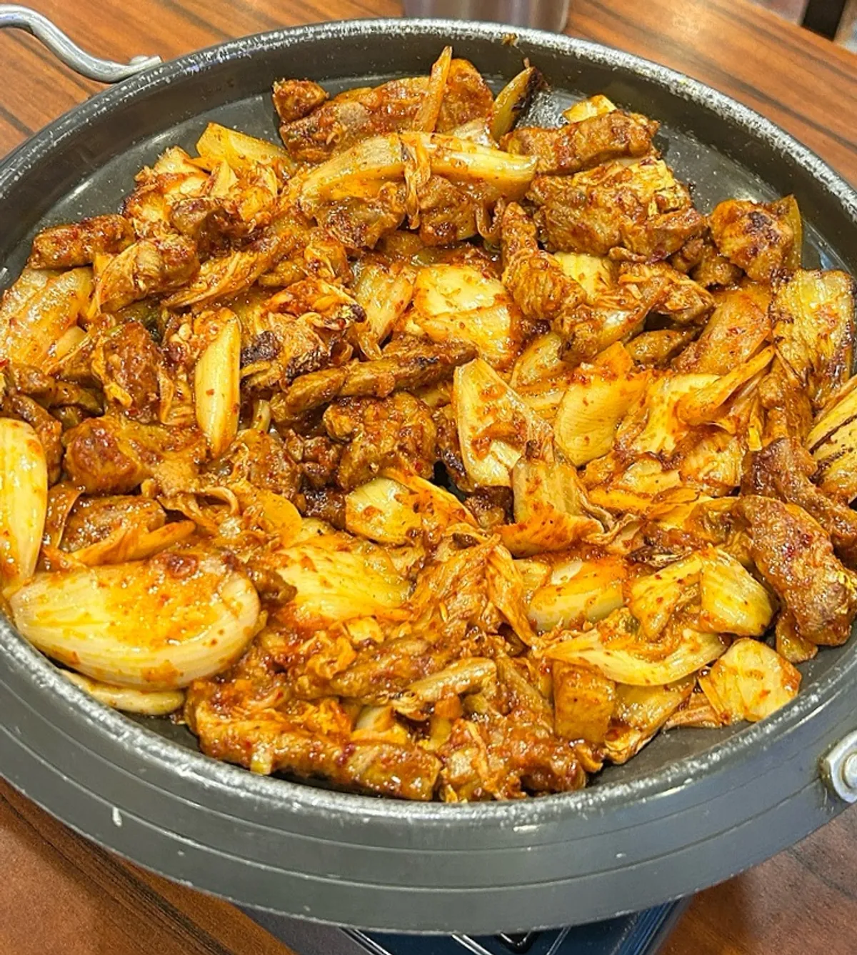 Pork kimchi grill loaded with kimchi, pork, and onion