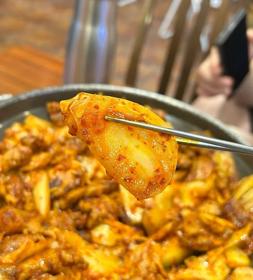 Close-up of fermented kimchi and tender pork