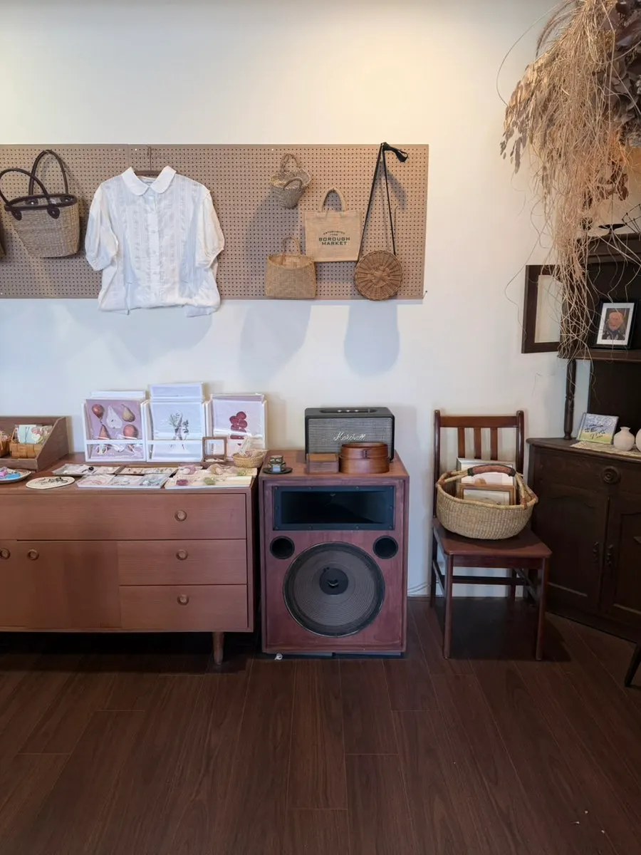 Shelf with postcards and other cute goods