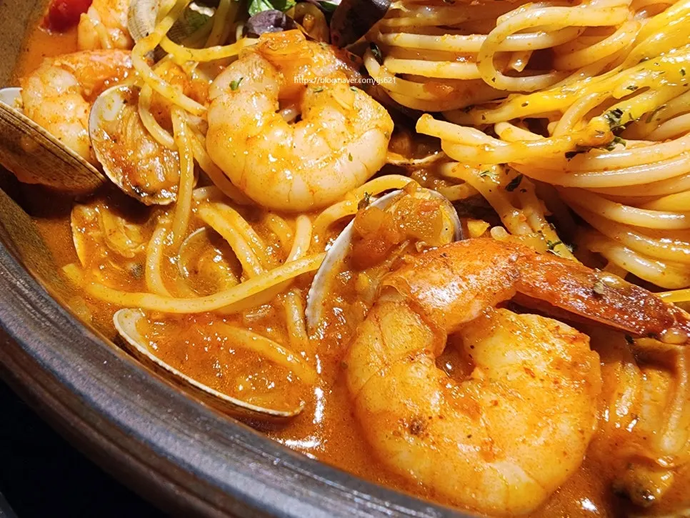 A big, plump shrimp from the seafood tomato pasta