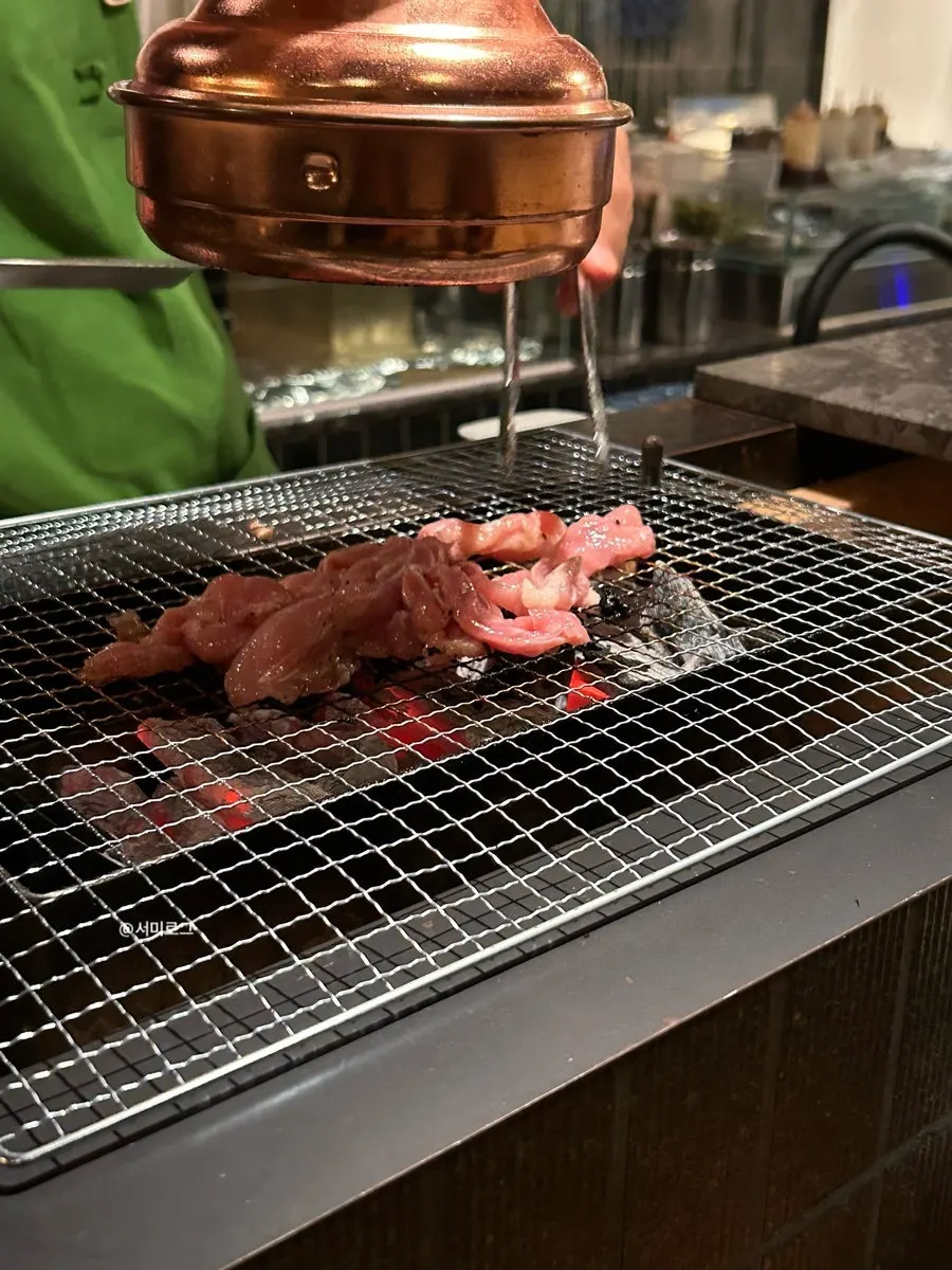 Grilled chicken thigh served with chili sauce