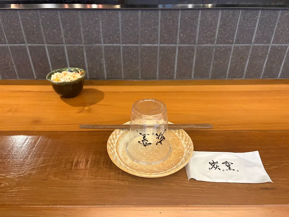 Charcoal grill in front of the dachi counter