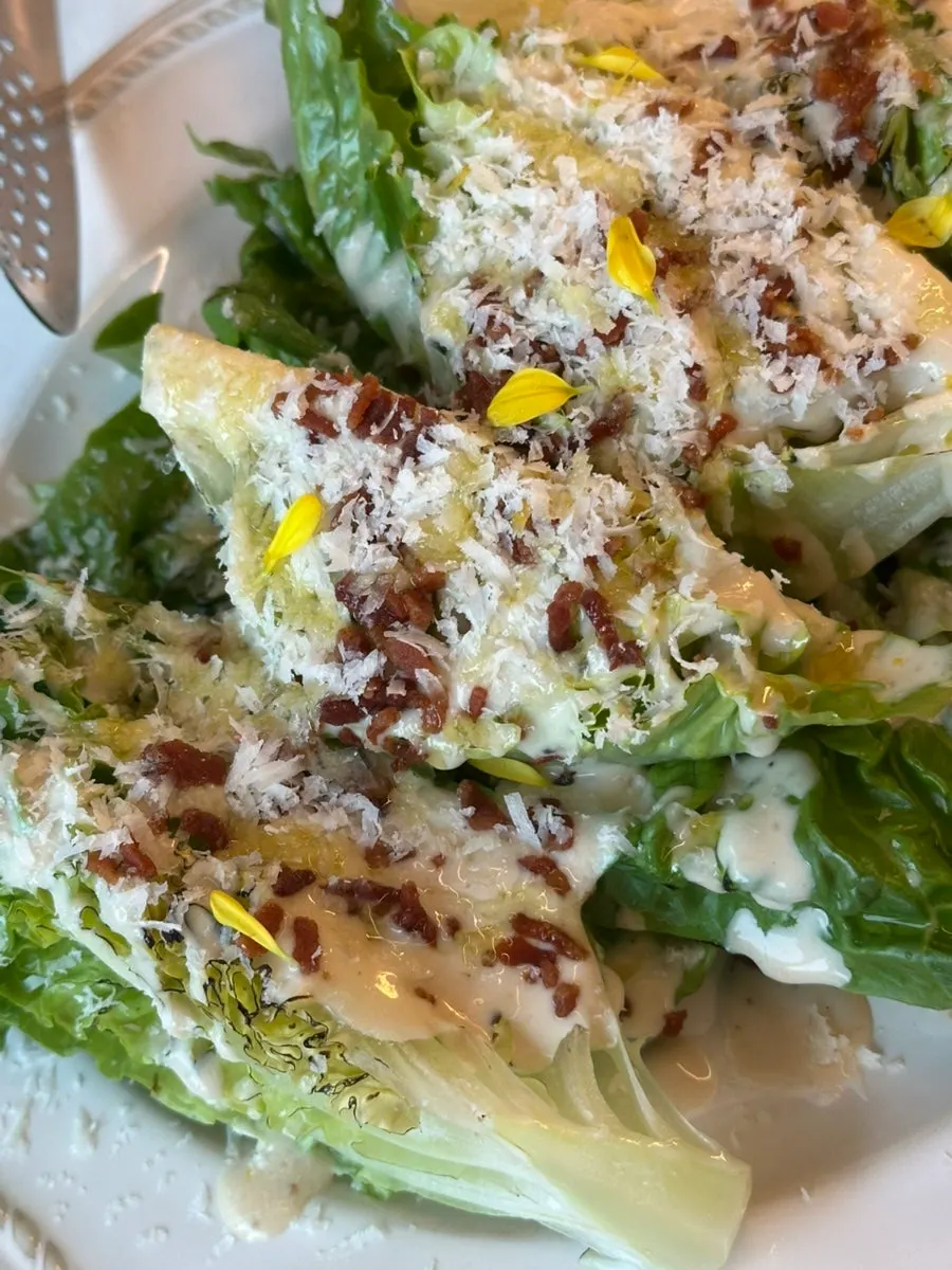 Romaine served with Caesar dressing