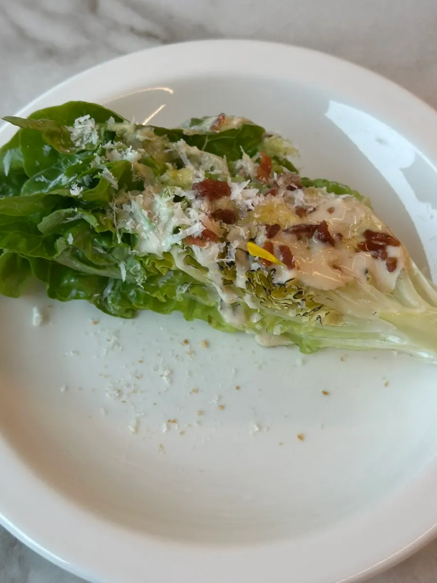 Slicing the Caesar salad with a knife