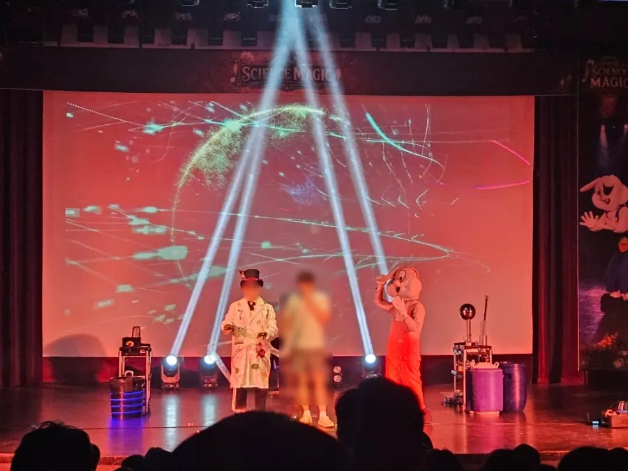 A child on stage experiencing levitation