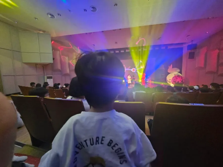 Parents and children participating together from the audience
