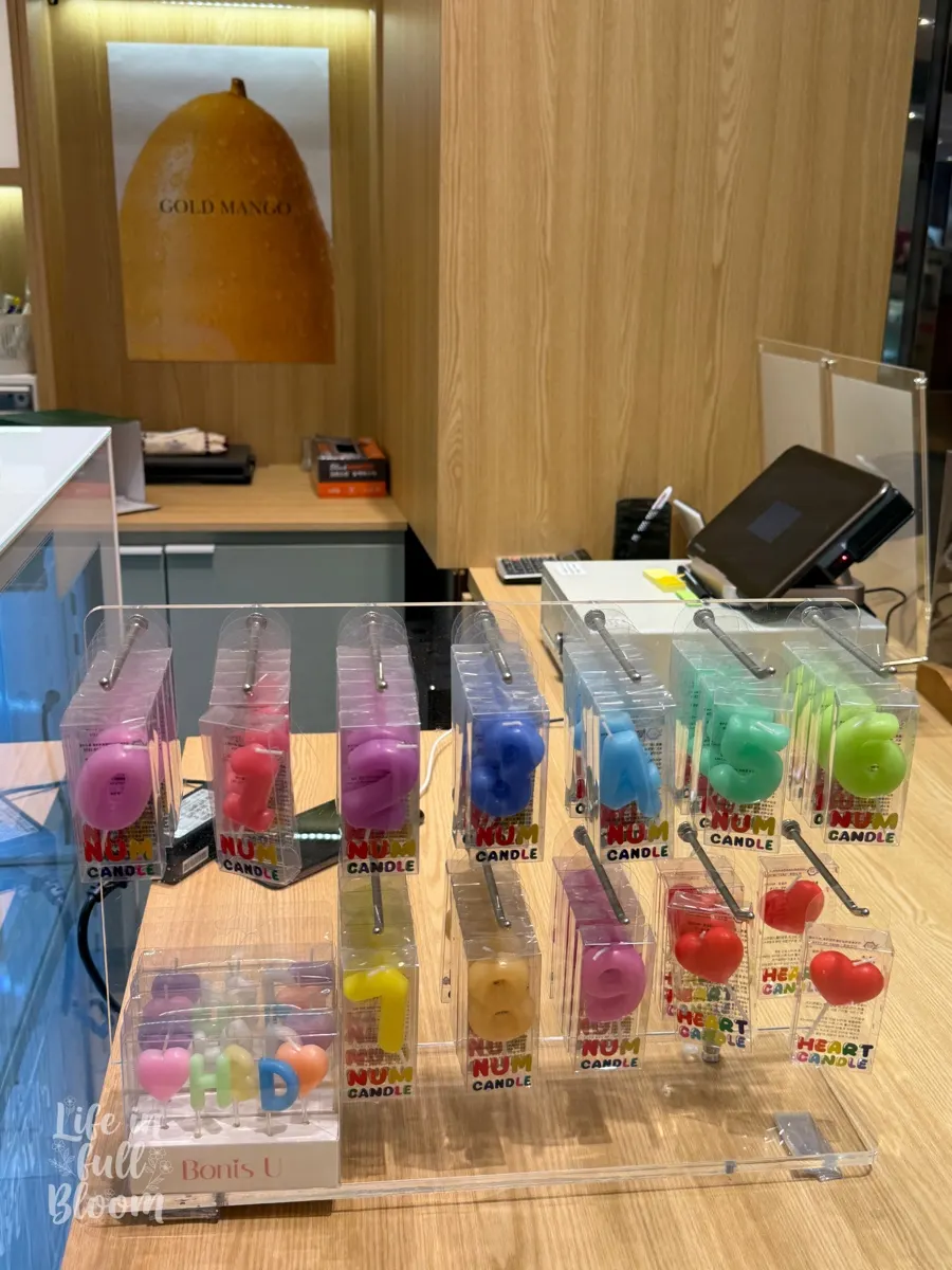 Number and birthday candles by the register