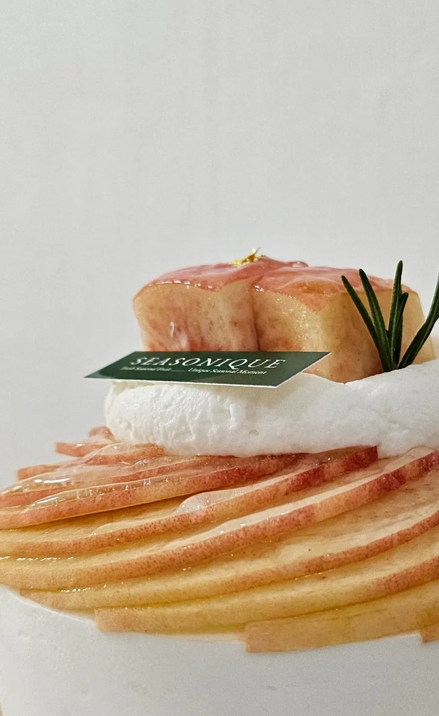 Floral Peach topped with rosemary garnish and gold leaf