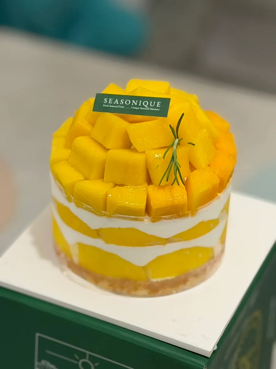 Mini-size cake piled high with mango