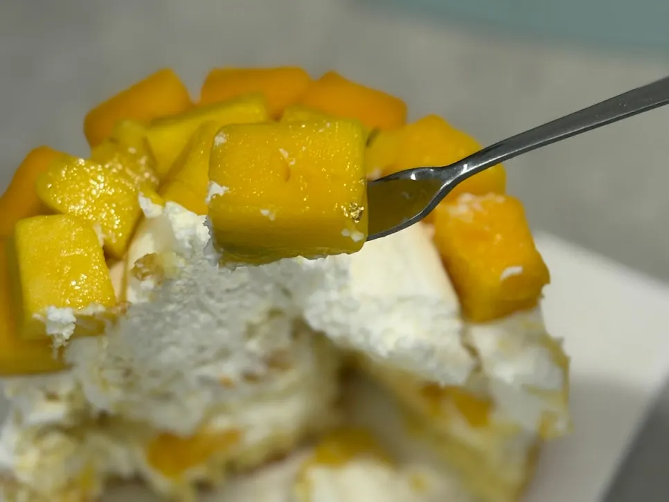 A plated slice of mango cake