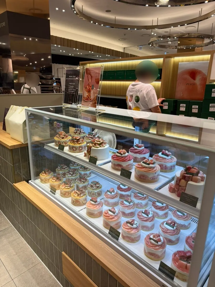 Showcase of peach-season cakes on display