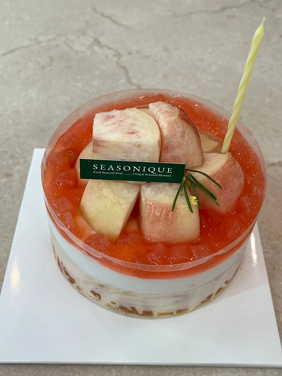 Close-up of the cake topped with peach slices