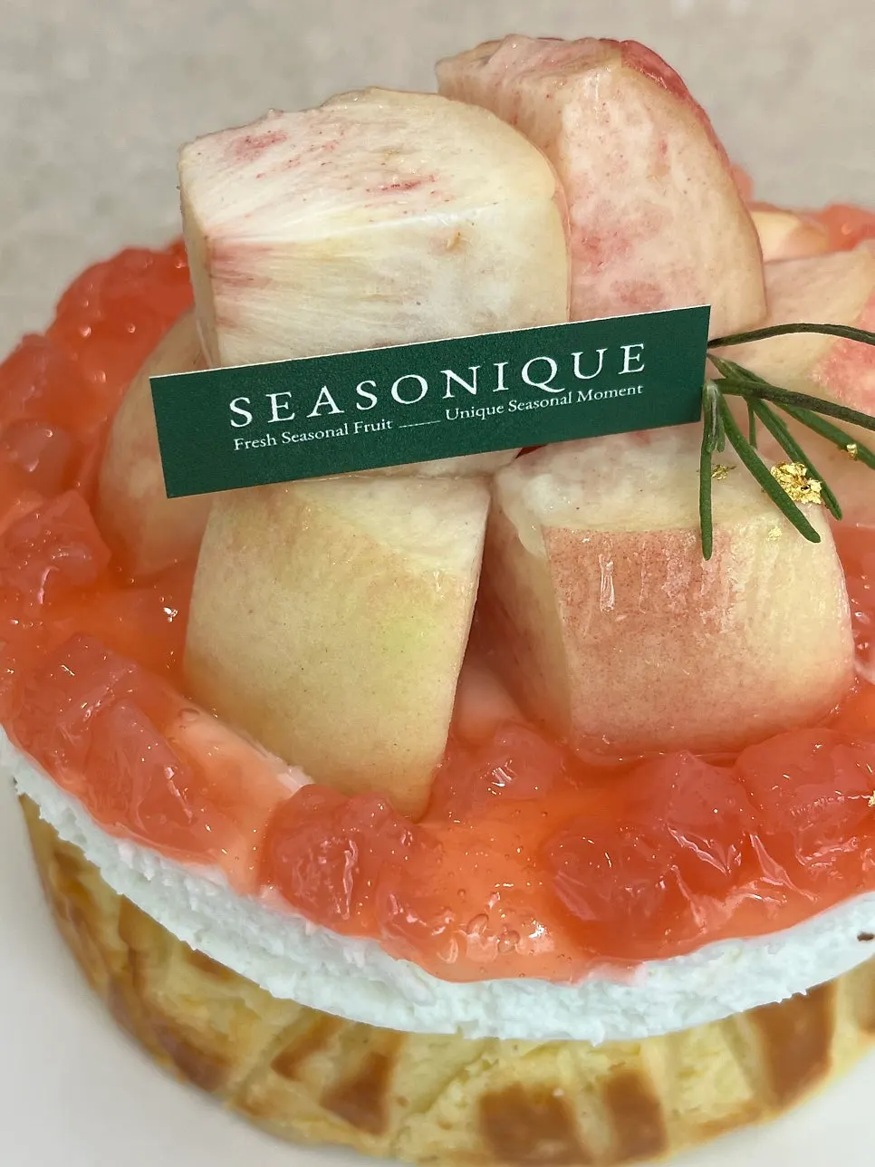 A slice of peach cake served on a plate