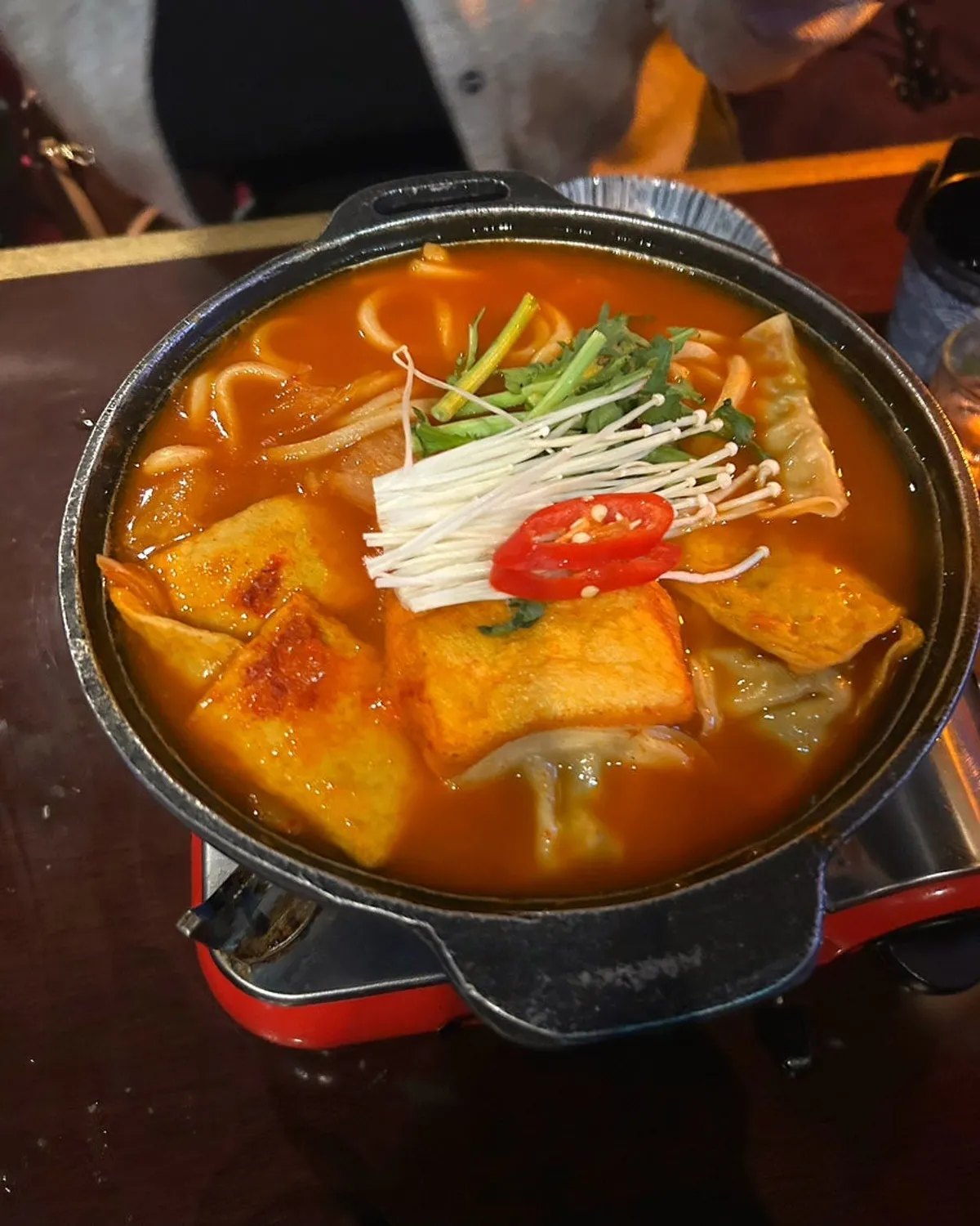 Fried tofu kimchi udon piled high with tofu and kimchi