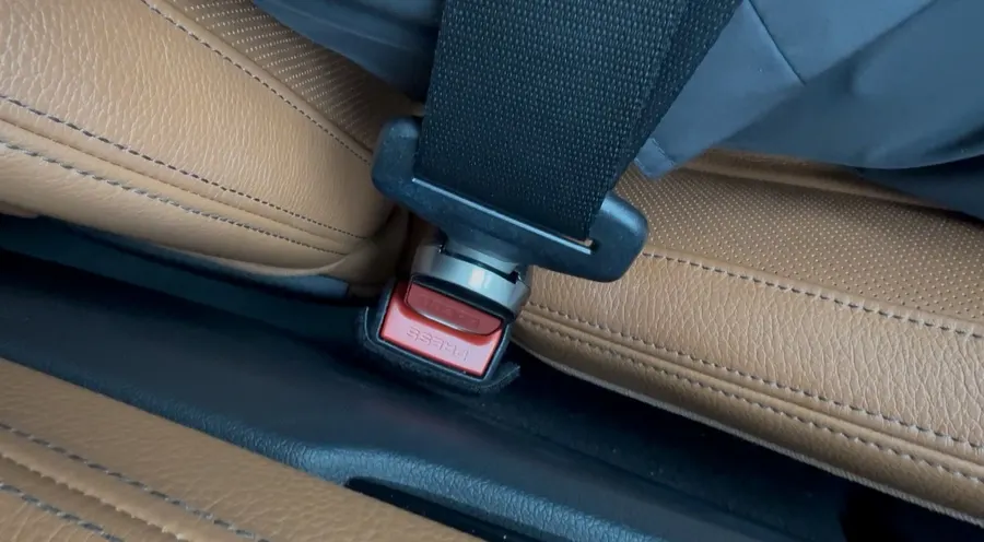A BMW seat belt being worn