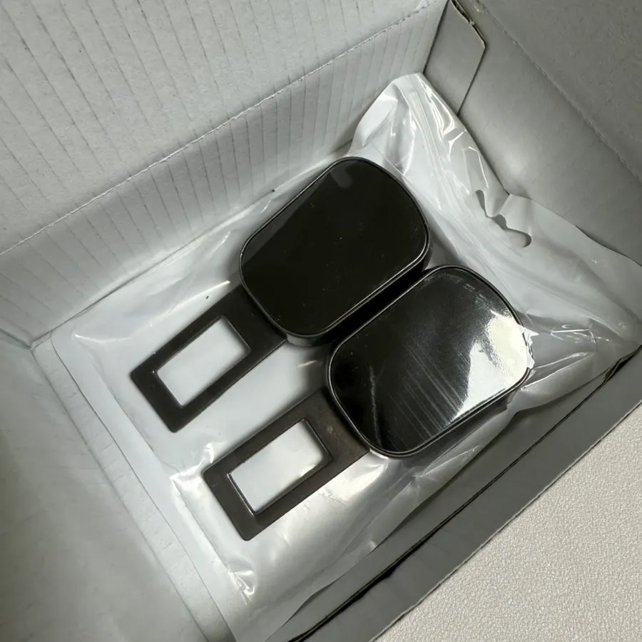 Finish of a dark black seat belt clip