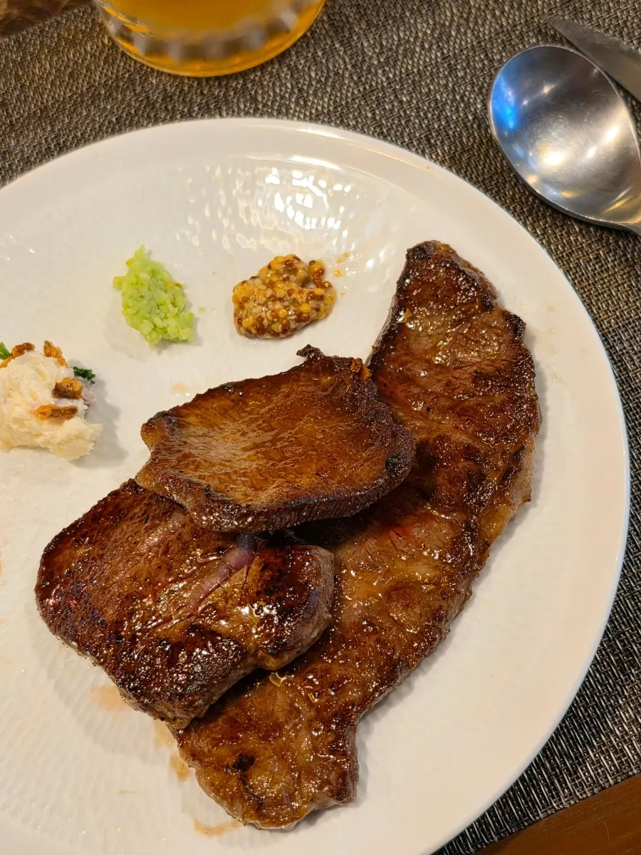 Flat iron steak with demi-glace sauce and tenderloin steak