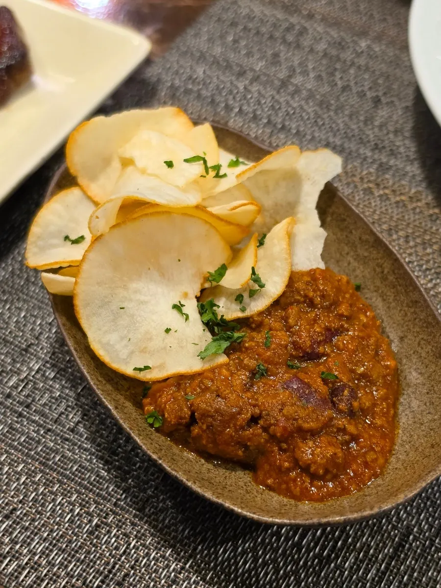 Mexican-style minced meat tomato dish served with potato chips