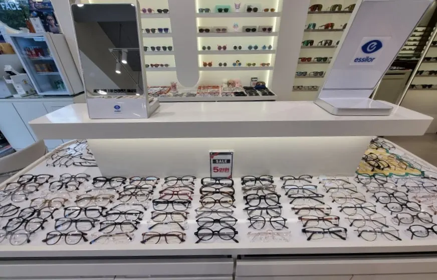 Wall of eyeglass frames on display