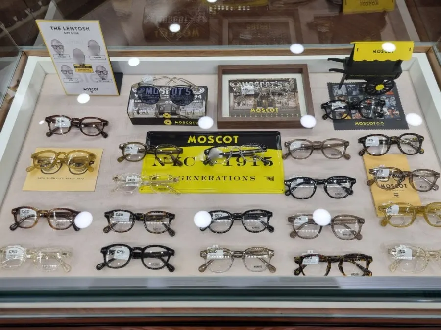 Display case holding house-brand frames