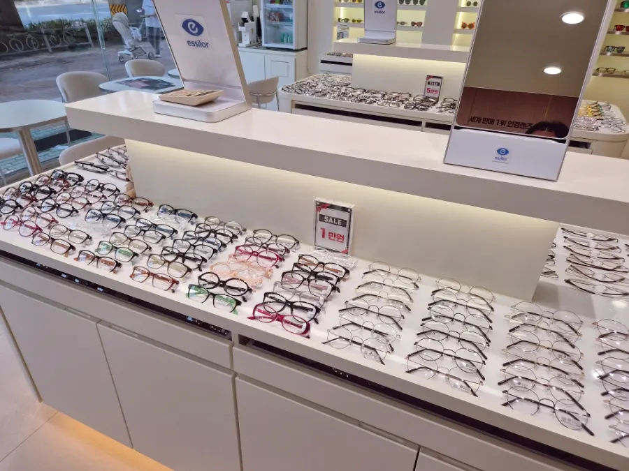 Eyeglass frames displayed by brand in the store