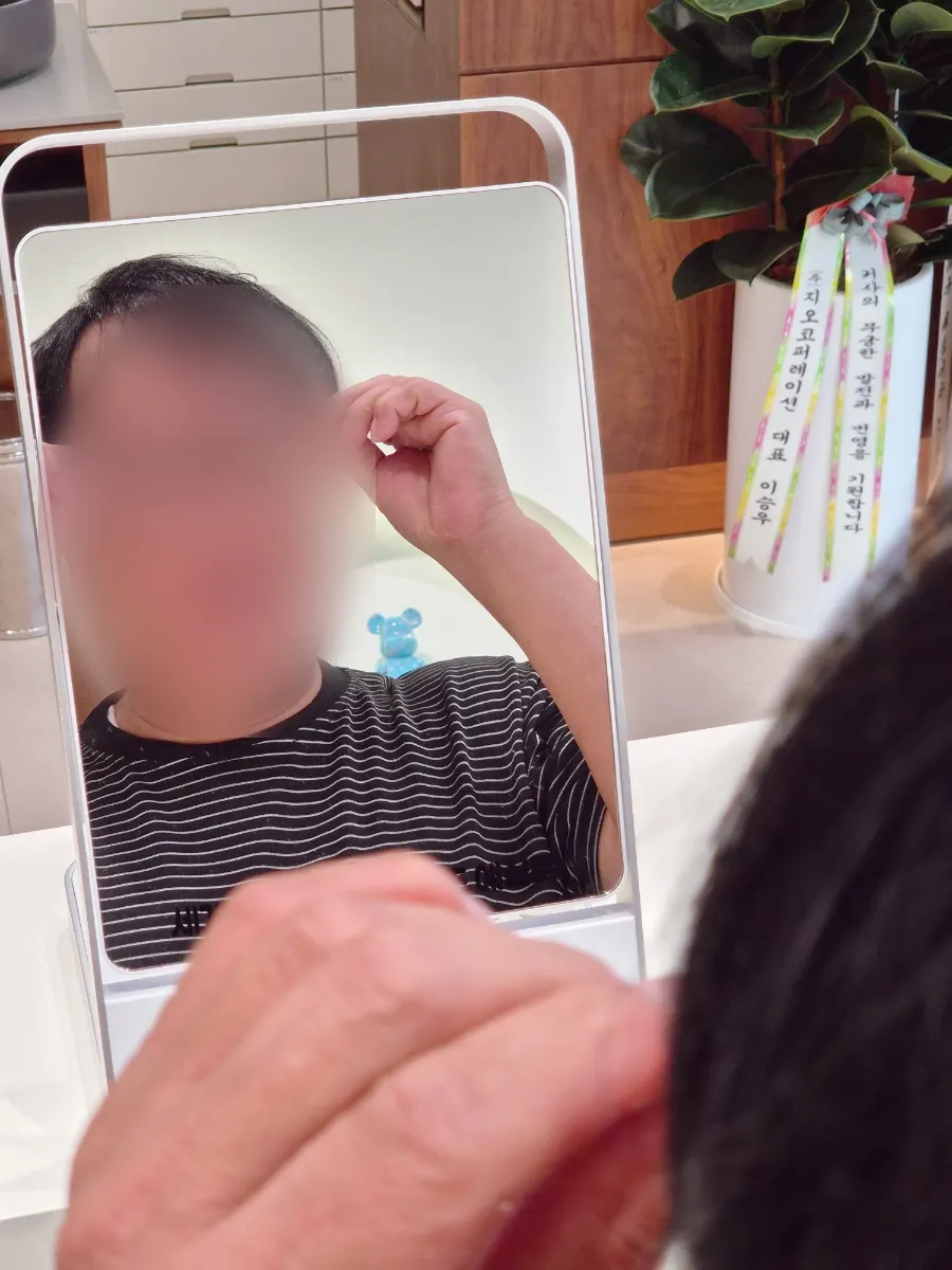 Father trying on eyeglass frames